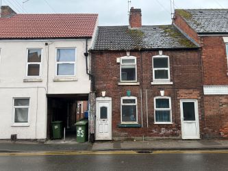 A vacant freehold three bedroom mid terraced property