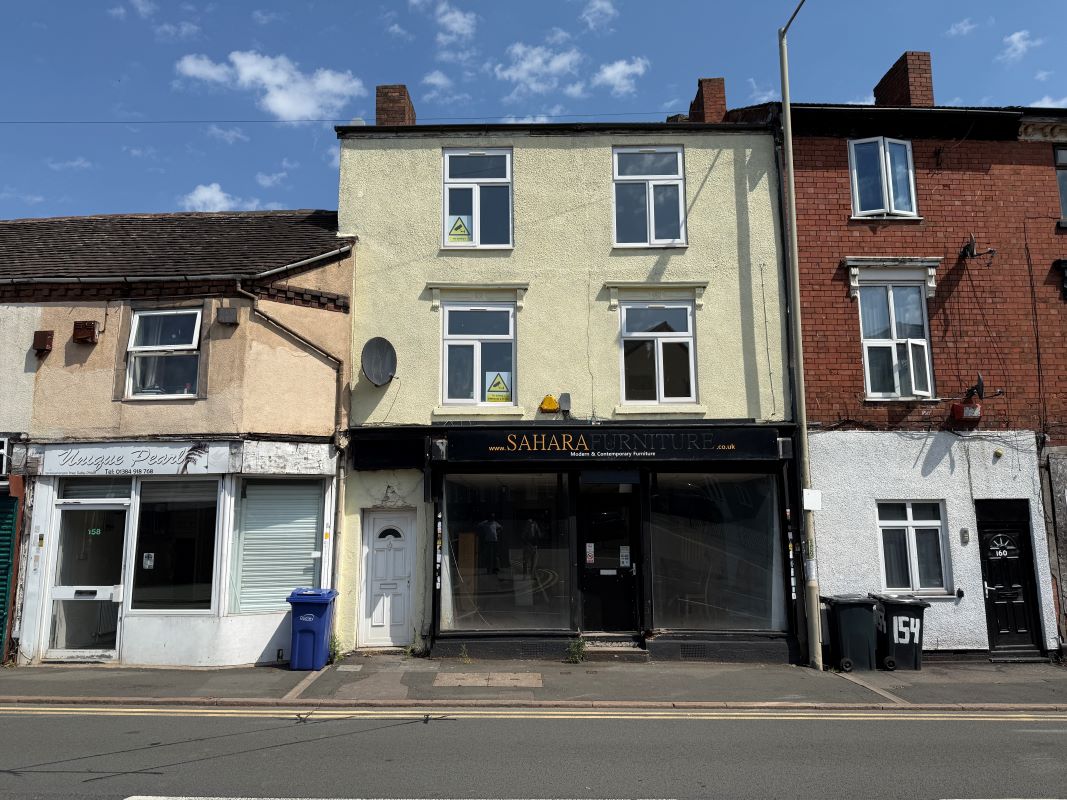 A vacant freehold spacious retail/showroom unit with self contained flats above in Dudley